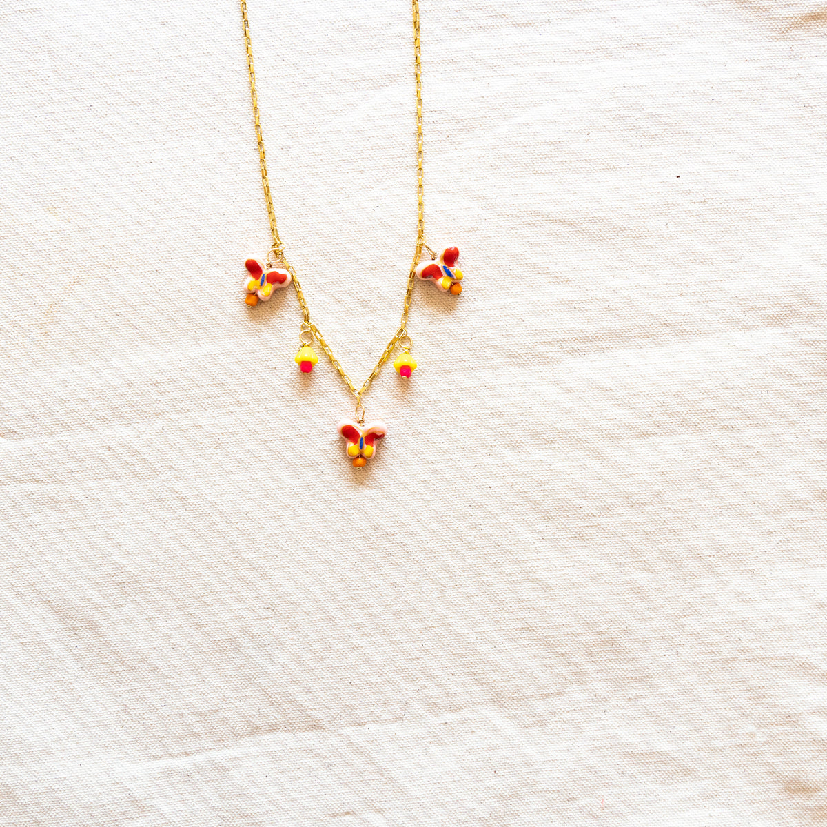 Butterflies Charm Necklace In Yellow